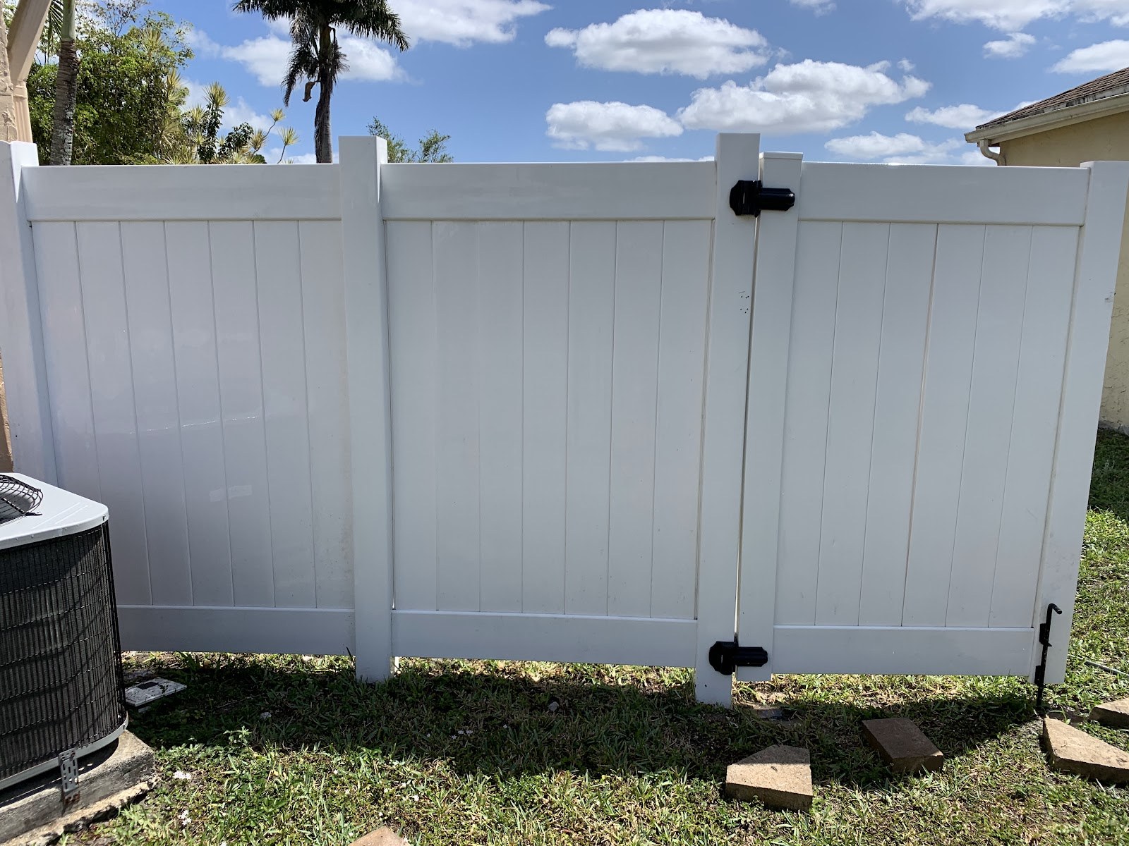 Vinyl privacy fence, restored to white